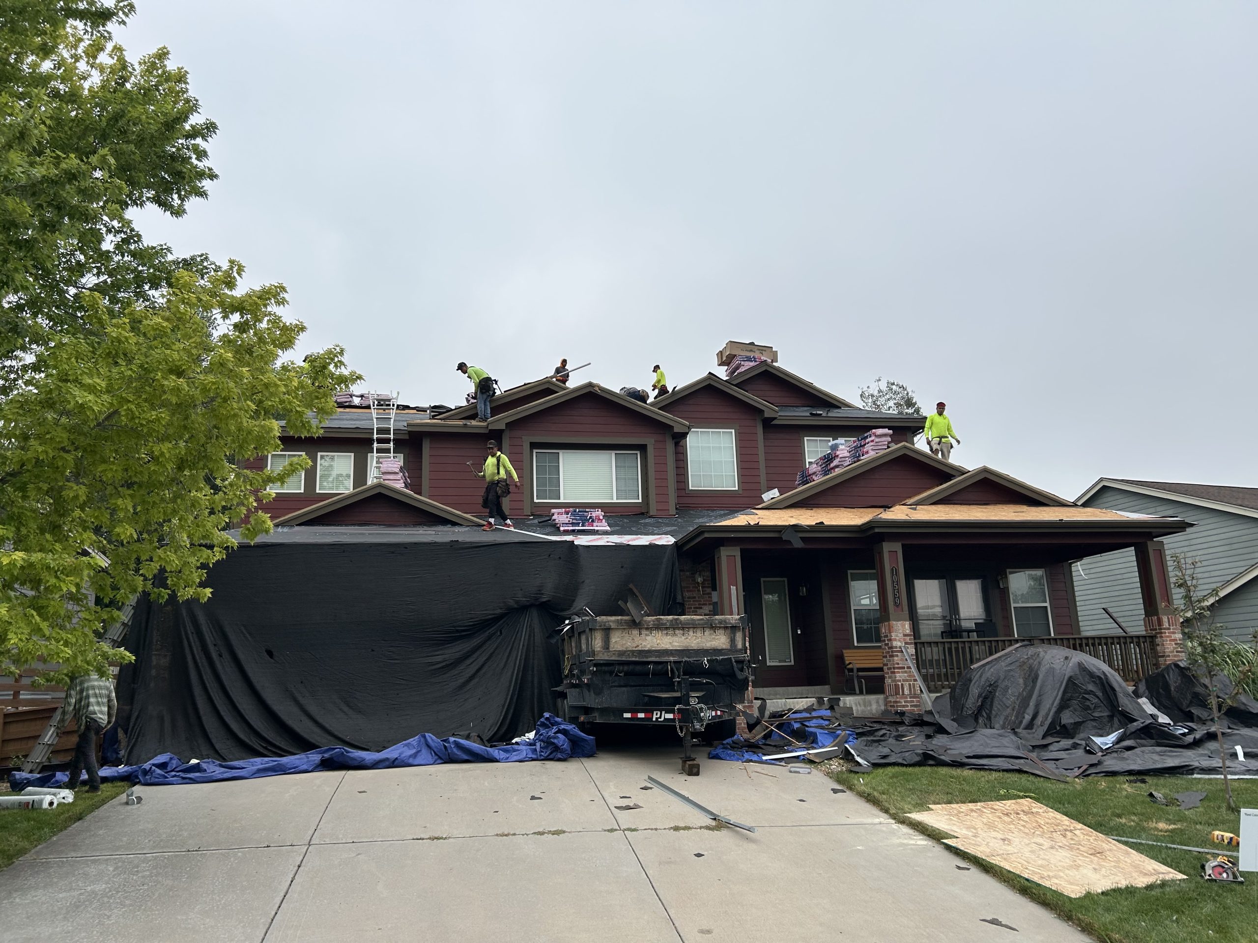 Reel Roofing crew repairs and replaces a residential roof in Colorado 