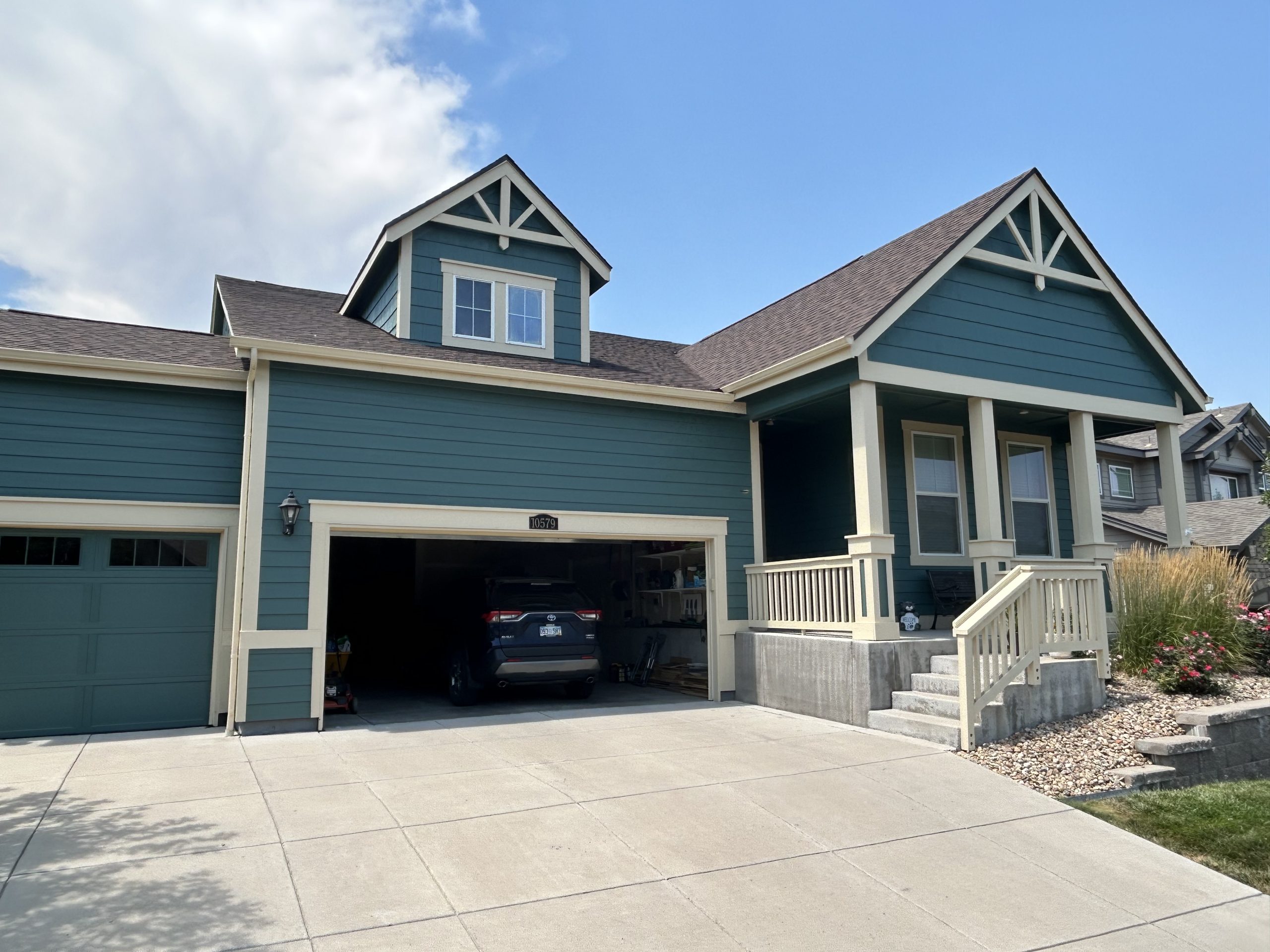 blue siding and new roof installation on a house in colorado 